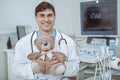 Friendly male pediatrician working at the clinic