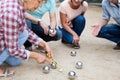 friendly mature couples playing petanque at leisure