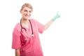 Friendly medical nurse lady smiling pointing copyspace Royalty Free Stock Photo