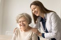 Friendly medical professional give care and support to elderly person