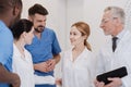 Friendly medical team meeting new colleague in the clinic Royalty Free Stock Photo