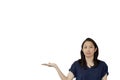 Friendly mixed race casual Asian mature woman presenting gesture with copy space for advertising