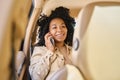 Mixed race female travels in the back seat ofcar Royalty Free Stock Photo