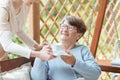 Smiling elder with cup of tea Royalty Free Stock Photo