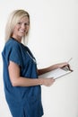 Friendly nurse holding clipboard Royalty Free Stock Photo