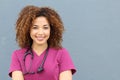 Friendly nurse with stethoscope isolated on blue background Royalty Free Stock Photo