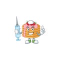 Friendly Nurse strawberry cream pancake mascot design style using syringe Royalty Free Stock Photo