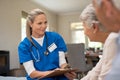 Friendly nurse talking with old couple Royalty Free Stock Photo