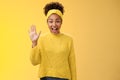 Friendly outgoing excited cute millennial female coworker newbie greeting team waving palm hi hello gesture energized Royalty Free Stock Photo