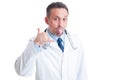 Friendly pediatrician making funny face and contact us gesture Royalty Free Stock Photo