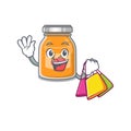 A friendly rich apple jam waving and holding Shopping bag