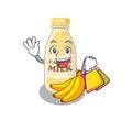 A friendly rich cashew milk waving and holding Shopping bag