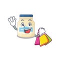 A friendly rich mayonnaise waving and holding Shopping bag