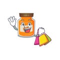 A friendly rich peach jam waving and holding Shopping bag