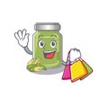 A friendly rich pistachio butter waving and holding Shopping bag