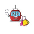 A friendly rich ropeway waving and holding Shopping bag