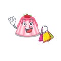 A friendly rich strawberry jelly waving and holding Shopping bag