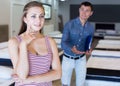 Friendly seller demonstrating to woman mattress Royalty Free Stock Photo