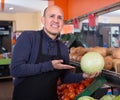 Friendly sellers offering fresh cabbage