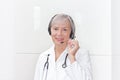 Friendly senior doctor headset microphone Royalty Free Stock Photo