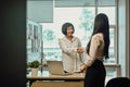 Friendly senior team leader shaking hand welcoming new employee Royalty Free Stock Photo