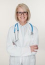 Friendly senior woman doctor is smiling. Isolated Royalty Free Stock Photo