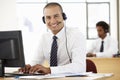 Friendly Service Agent Talking To Customer In Call Centre Royalty Free Stock Photo