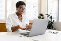 African-American female office employee using laptop Royalty Free Stock Photo