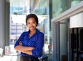 Friendly smiling business woman standing outside in the city Royalty Free Stock Photo