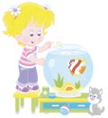 Small girl with an aquarium fish and a kitten Royalty Free Stock Photo