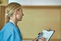 Friendly smiling doctor and patient sitting on the couch. Very good news and high level medical care concept. Royalty Free Stock Photo