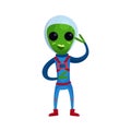 Friendly smiling green alien with big eyes wearing blue space suit waving his hand, alien positive character cartoon Royalty Free Stock Photo