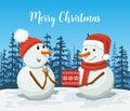 Friendly Snowmen in a santa hat. Snowwoman. Royalty Free Stock Photo