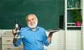 Friendly teacher in classroom near blackboard desk. Tutoring. World teachers day. Thank You Teacher. Professor in class Royalty Free Stock Photo