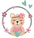 Friendly teddy bear peeking out of spring round frame Royalty Free Stock Photo