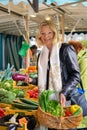 Friendly woman shopping for fresh vegetables Royalty Free Stock Photo