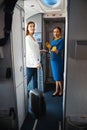 Friendly women looking ready for the international flight