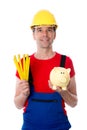 Friendly worker with yardstick and piggy bank