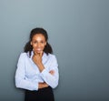 Friendly young business woman thinking Royalty Free Stock Photo