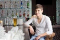 Friendly young man drinking in a bar Royalty Free Stock Photo