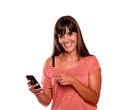 Friendly young woman pointing her cellphone Royalty Free Stock Photo