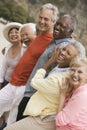 Friends arm in arm at beach (portrait) Royalty Free Stock Photo