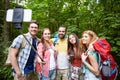 Friends with backpack taking selfie by smartphone Royalty Free Stock Photo