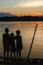 3 friends on the bank of Mahakam river, Kalimantan
