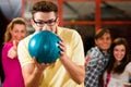 Friends bowling having fun Royalty Free Stock Photo