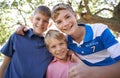 Friends, brothers and hugging in outdoor portrait, children and care in childhood or smiling. Happy siblings, embrace Royalty Free Stock Photo