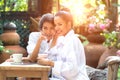 Friends bursting out laughing while having coffee