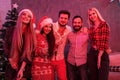 Friends celebrating Christmas or New Year eve at home Royalty Free Stock Photo