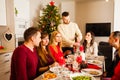 Friends celebrating Christmas or New Year eve at home Royalty Free Stock Photo