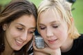 Friends on Cell Phone together (Beautiful Young Blonde and Brunette Girls)